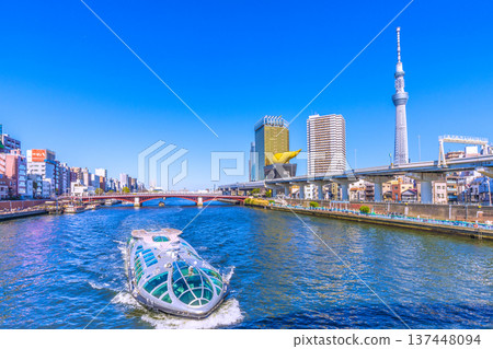 Tokyo cityscape in Japan, with views of Azumabashi Bridge, the water bus "Emeraldas," Tokyo Skytree, and more (March 8th) 137448094