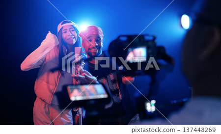 Musicians recording song in music studio for video Musicians recording song in music studio for video 137448269