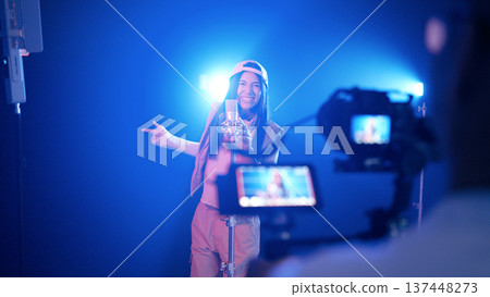 Female singer recording song in music studio Female singer recording song in music studio 137448273
