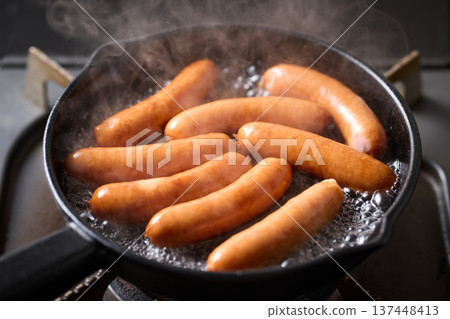 Heat the sausage in a skillet 137448413