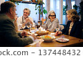 Senior friends enjoying dinner party at home 137448432