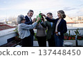 Seniors friends toasting with bottles celebrating on rooftop 137448450