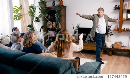 Group of seniors playing charades game at home 137448459