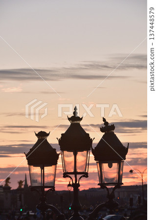 Silhouette of Parisian street lights against a sunset sky. Paris, France. Photo taken on March 2, 2026. Silhouette of Parisian street lights against a sunset sky. Paris, France. Photo taken on March 2, 2026. 137448579