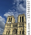 Majestic Notre-Dame Cathedral stands under a bright blue sky in Paris 137448597