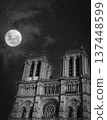 Nighttime view of Notre-Dame Cathedral illuminated under the moonlight 137448599