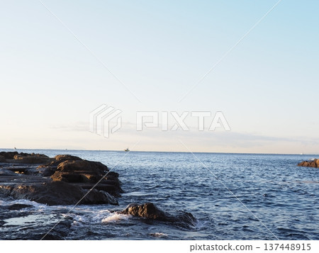 Waves crashing into a tide pool. Natural copy space. Ocean art. Waves crashing into a tide pool. Natural copy space. Ocean art. 137448915