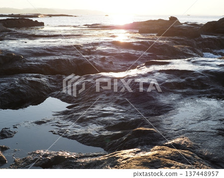 Waves crashing into a tide pool. Natural copy space. Ocean art. Waves crashing into a tide pool. Natural copy space. Ocean art. 137448957