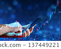 Business man trader investor analyst using mobile phone app analytics for cryptocurrency financial market analysis, trading data index chart graph on smartphone. 137449221