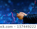 Business man trader investor analyst using mobile phone app analytics for cryptocurrency financial market analysis, trading data index chart graph on smartphone. 137449222