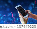 Business man trader investor analyst using mobile phone app analytics for cryptocurrency financial market analysis, trading data index chart graph on smartphone. 137449223