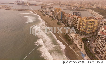 Spanish Coastal Cityscape Engulfed in Dramatic Moroccan Sandstorm, Featuring Urban Beach, Tall Buildings, and Bustling PortSpain in sandstorm from Moroco Spanish Coastal Cityscape Engulfed in Dramatic Moroccan Sandstorm, Featuring Urban Beach, Tall Buildings, and Bustling PortSpain in sandstorm from Moroco 137451531