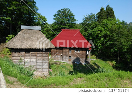 Two charming houses in a mountain village in early summer Two charming houses in a mountain village in early summer 137451574