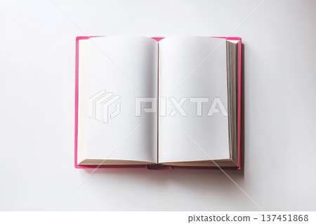 A beautifully arranged open book on a pristine white surface framed by a delicate pink border. A beautifully arranged open book on a pristine white surface framed by a delicate pink border. 137451868