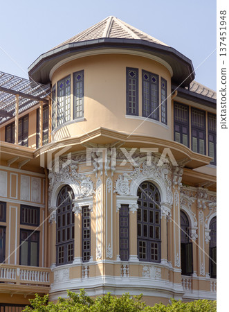 The Bang Khun Phrom Palace, now home to the Bank of Thailand Museum, is a magnificent early 20th-century royal residence. Situated on the banks of the Chao Phraya River, its exterior showcases a grand The Bang Khun Phrom Palace, now home to the Bank of Thailand Museum, is a magnificent early 20th-century royal residence. Situated on the banks of the Chao Phraya River, its exterior showcases a grand 137451948