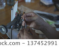 A man making a fly 137452991