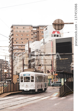Streetcars running through the city of Nagasaki Streetcars running through the city of Nagasaki 137453066