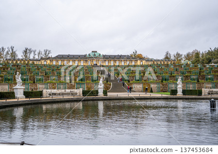 Sanssouci park in Potsdam, Germany. Old garden stairs building architecture in Rococo style. Nature outdoor landscape Pond Fontaine 137453684