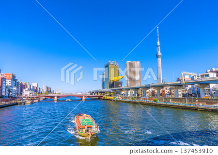 Tokyo cityscape in Japan, with views of the water buses "Ryuma" and "Urban Lunch II," as well as a houseboat (foreground) Tokyo cityscape in Japan, with views of the water buses "Ryuma" and "Urban Lunch II," as well as a houseboat (foreground) 137453910