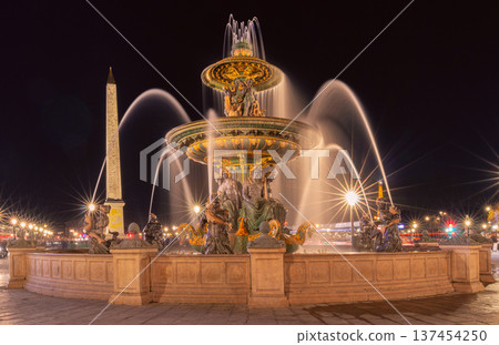 Illuminated fountain at Place de la Concorde in Paris at night Illuminated fountain at Place de la Concorde in Paris at night 137454250