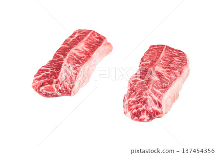Raw Top blade steak, beef shoulder meat isolated on white background. top view Raw Top blade steak, beef shoulder meat isolated on white background. top view 137454356