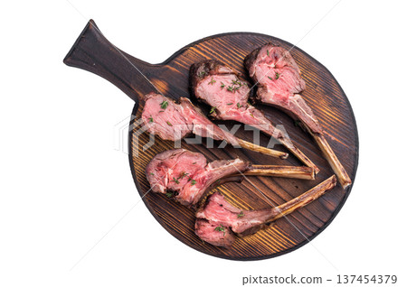 French roast lamb chops, mutton meat steaks on wooden board isolated on white backgrounds French roast lamb chops, mutton meat steaks on wooden board isolated on white backgrounds 137454379