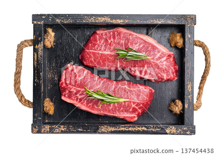 Raw Top blade steak, shoulder beef meat in wooden tray isolated on white background. top view Raw Top blade steak, shoulder beef meat in wooden tray isolated on white background. top view 137454438