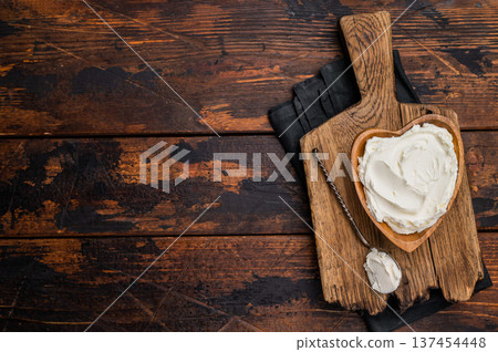 Traditional Mascarpone cheese in wooden bowl. wooden background. top view Traditional Mascarpone cheese in wooden bowl. wooden background. top view 137454448
