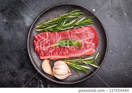 Australian Oyster Top blade steak, Fresh Beef shoulder meat on plate. black background. top view Australian Oyster Top blade steak, Fresh Beef shoulder meat on plate. black background. top view 137454484