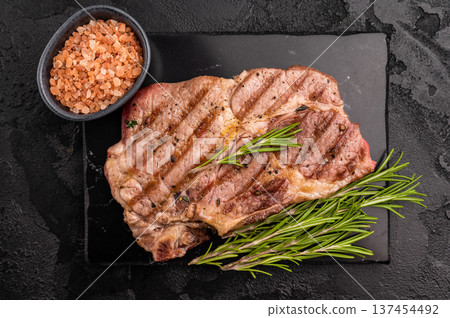 Grilled pork neck steaks. black background. top view 137454492