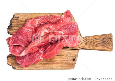 Beautifully arranged raw horse meat slices on a wooden platter, showcasing its appealing color and texture, perfect for cooking inspiration. isolated on white background. top view 137454567