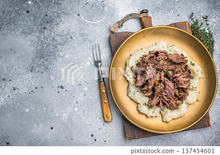 Homemade French Beef Bourguignon Stew on a plate with mashed potatoes. grey background. top view 137454601
