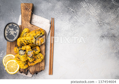Gimmari, korean deep fried snack, seawed rolls and noodles glass. grey background. top view Gimmari, korean deep fried snack, seawed rolls and noodles glass. grey background. top view 137454604