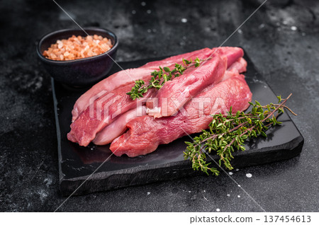 Raw sliced duck breast fillet, uncooked poultry meat. black background. top view 137454613