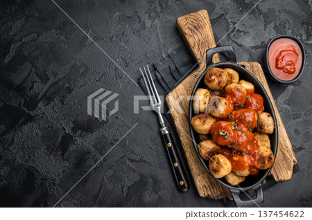 Hearty meatballs, beef balls, bursting with flavor and served in a rich tomato sauce. A beloved dish that combines tradition and taste for every occasion. black background. top view 137454622