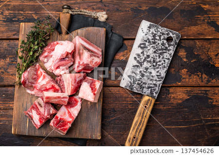 Raw diced Beef meat with bones for stew or goulash on wooden board. wooden background. top view 137454626