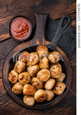 Delicious meatballs, meat patties, showcasing a golden crust and tender interior. isolated on wooden background. top view 137454676