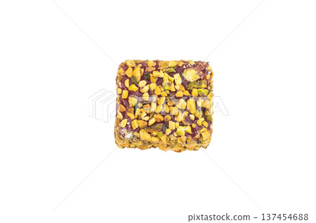 Premium pistachio lokum delight with nut and berry pieces. Traditional jelly candy top view with copy space. Premium pistachio lokum delight with nut and berry pieces. Traditional jelly candy top view with copy space. 137454688