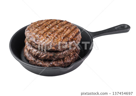 Grilled beef and lamb hamburger patty with seared crust and juicy texture in cast iron skillet. Cooked mixed meat on isolated background. Grilled beef and lamb hamburger patty with seared crust and juicy texture in cast iron skillet. Cooked mixed meat on isolated background. 137454697