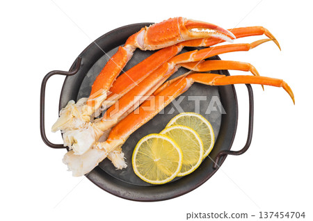 Cooked king red crab legs with lemon and salt on metal plate isolated background copy space for menu Cooked king red crab legs with lemon and salt on metal plate isolated background copy space for menu 137454704