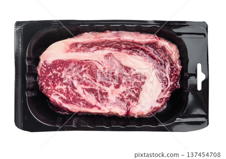 Raw ribeye steak also known as entrecote scotch fillet or delmonico. Marbled beef rib cut isolated on white background. 137454708