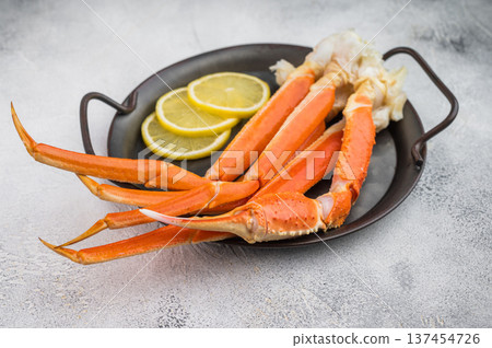 Luxury king red crab seafood served with lemon slices on plate light background premium gourmet copy space Luxury king red crab seafood served with lemon slices on plate light background premium gourmet copy space 137454726