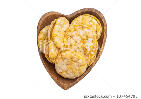Rice crackers in wooden bowl on light background. Healthy crunchy snack with copy space, top view. 137454793