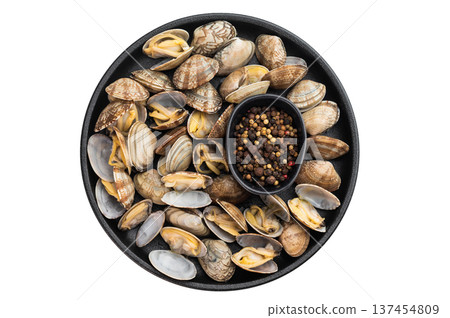 Steamed vongole mollusks in black pan with pepper and fork. Mediterranean shellfish composition with copy space. Steamed vongole mollusks in black pan with pepper and fork. Mediterranean shellfish composition with copy space. 137454809