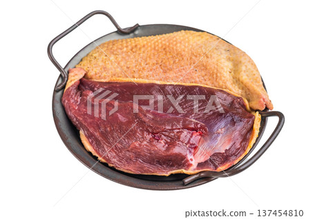 Whole raw duck breast with skin prepared in metal pan on isolated background. Poultry game meat ingredient top view with copy space. Whole raw duck breast with skin prepared in metal pan on isolated background. Poultry game meat ingredient top view with copy space. 137454810