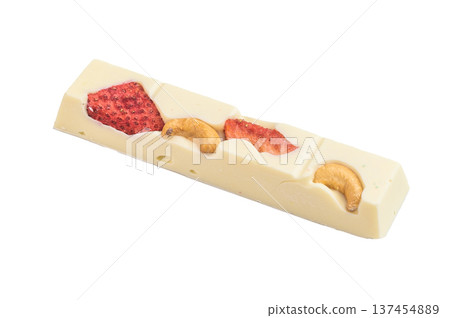 White craft chocolate bar with dried strawberry apple slices and cashew nuts on white background artisan handmade confectionery White craft chocolate bar with dried strawberry apple slices and cashew nuts on white background artisan handmade confectionery 137454889