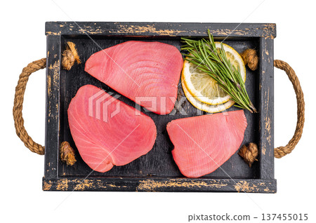 Freshly sliced raw tuna loin fillet, packed with flavor and nutrients, waiting to be transformed into exquisite seafood dishes. isolated on white background. top view Freshly sliced raw tuna loin fillet, packed with flavor and nutrients, waiting to be transformed into exquisite seafood dishes. isolated on white background. top view 137455015
