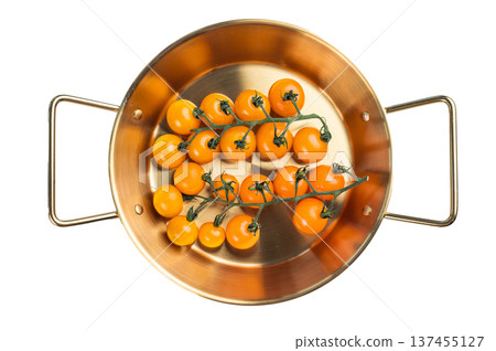 Yellow cherry tomatoes on vine in golden pan isolated on white background, fresh organic produce for cooking salads and healthy meals 137455127
