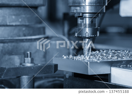 Precision boring operation on a metal plate using a CNC milling machine equipped with a flat nose end mill for accurate hole sizing. 137455188
