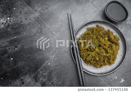 Edible sea grapes also called green caviar and sea caviar with bubble texture in gray bowl on white background Asian cuisine Edible sea grapes also called green caviar and sea caviar with bubble texture in gray bowl on white background Asian cuisine 137455198